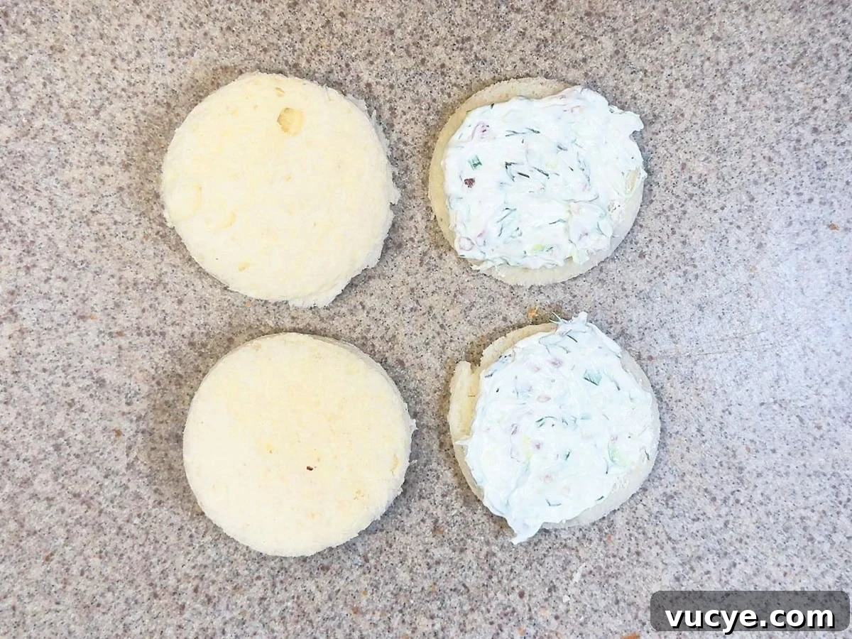 Cucumber Tea Sandwich Recipe for Light, Refreshing Tea Parties 6 Topping white bread cut into rounds with the cream cheese mixture and topping them with a second bread round.