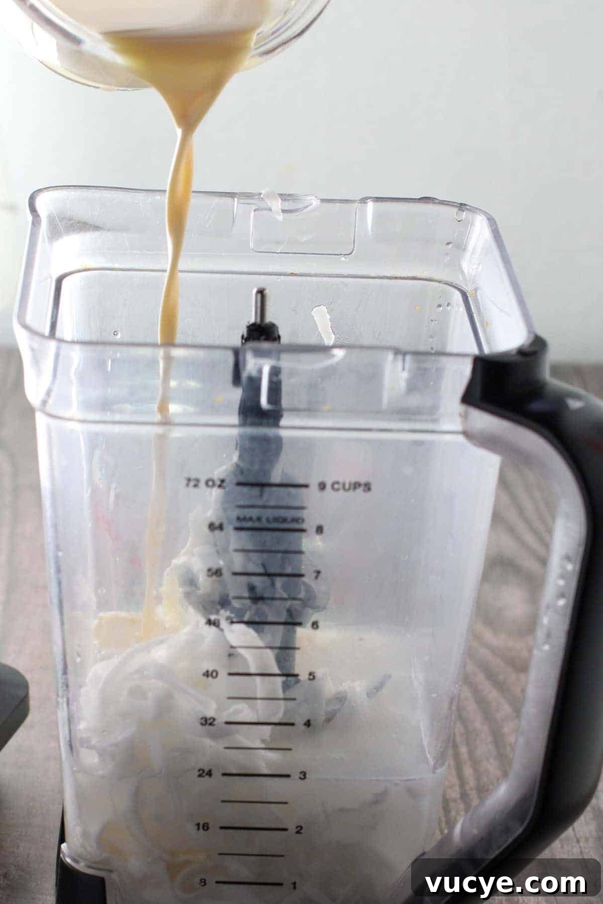 Creamy Filipino Buko Shake Recipe — Refreshing Coconut Milkshake 4 pouring evaporated milk in a blender with young coconut