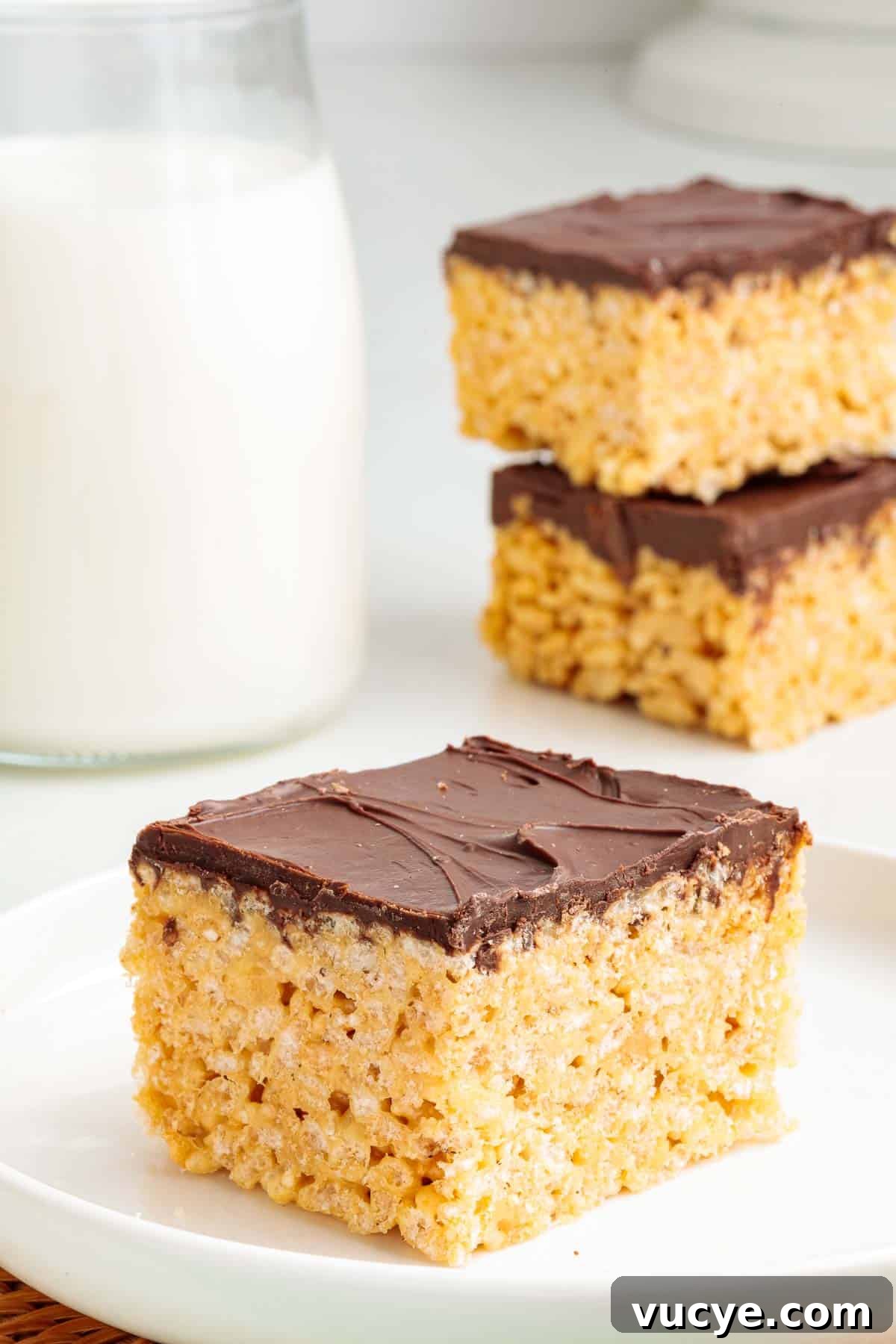 A peanut butter Rice Krispie with a smooth layer of chocolate on top.