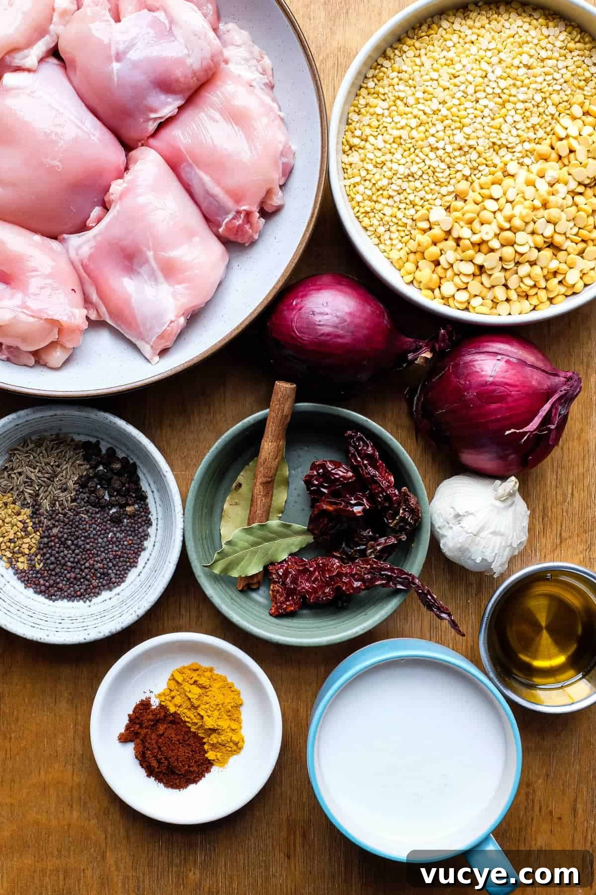 Chicken & Lentil Curry | cookeatworld.com The ingredients for a chicken lentil curry including chicken, two types of lentils, onion, whole spices, ground spices, garlic, chillies and coconut milk