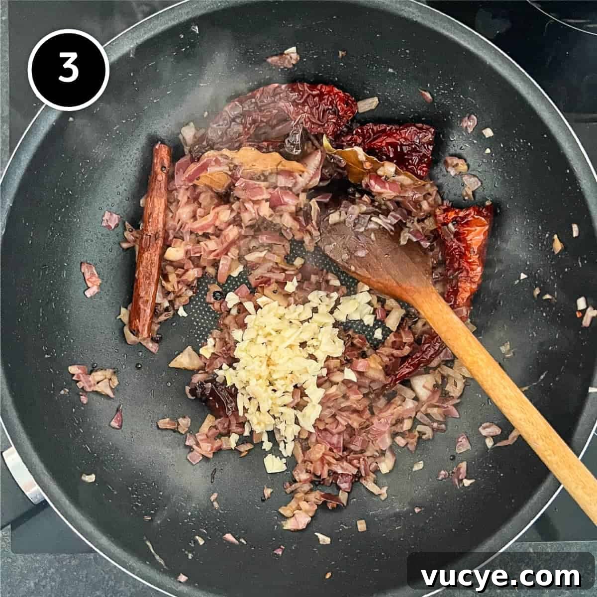 Chicken & Lentil Curry | cookeatworld.com Adding garlic to fried onion and spices