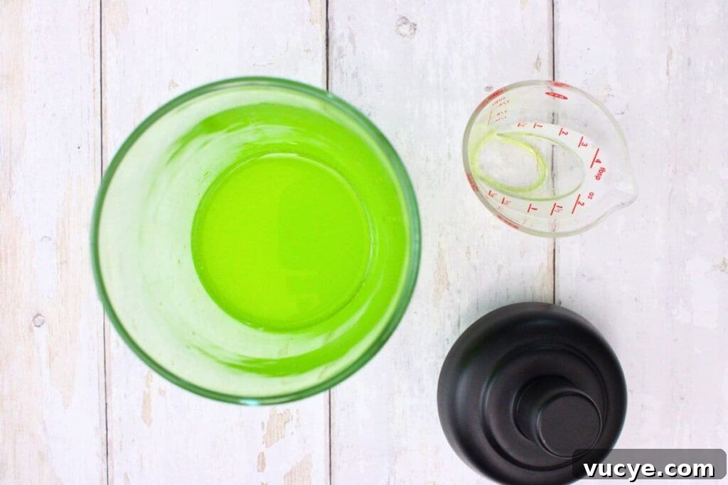 add tequila, midori, lime juice, and triple sec to a cocktail shaker