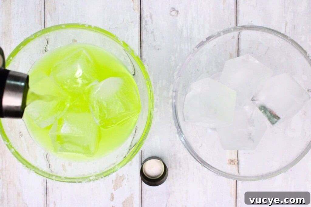 shake and strain midori margarita into a glass