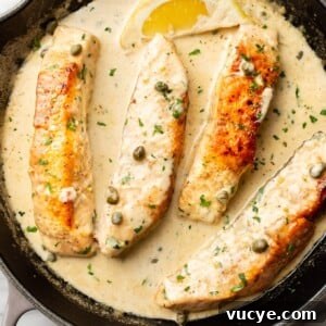 Creamy Lemon Salmon Piccata Recipe for Weeknight Dinners 7 salmon piccata in a cast iron pan
