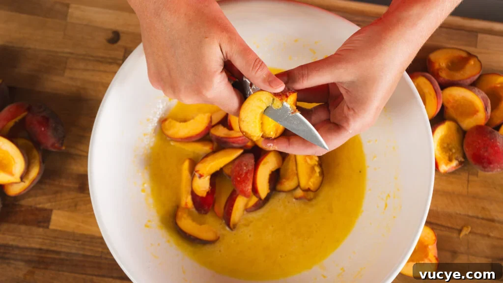 Rustic Peach Pie Recipe with a Flaky Homemade Crust 4 Cutting peaches for a peach pie recipe.