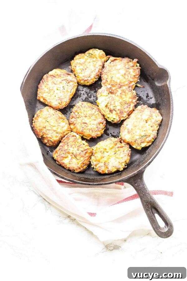 These zucchini feta fritters are quick and easy to make. A great appetizer or snack and really light. Crispy zucchini fritters contain the whole zucchini and are freezer friendly.