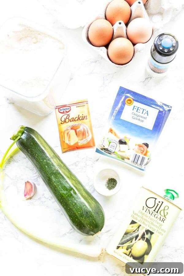 These zucchini feta fritters are quick and easy to make. A great appetizer or snack and really light. Crispy zucchini fritters contain the whole zucchini and are freezer friendly.