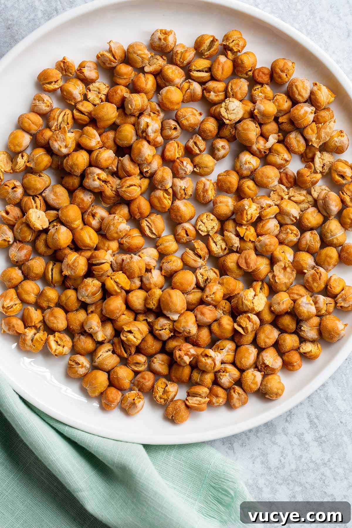 Crispy Oil-Free Air Fryer Chickpeas for Snacking 2 Crispy air fried chickpeas on a plate