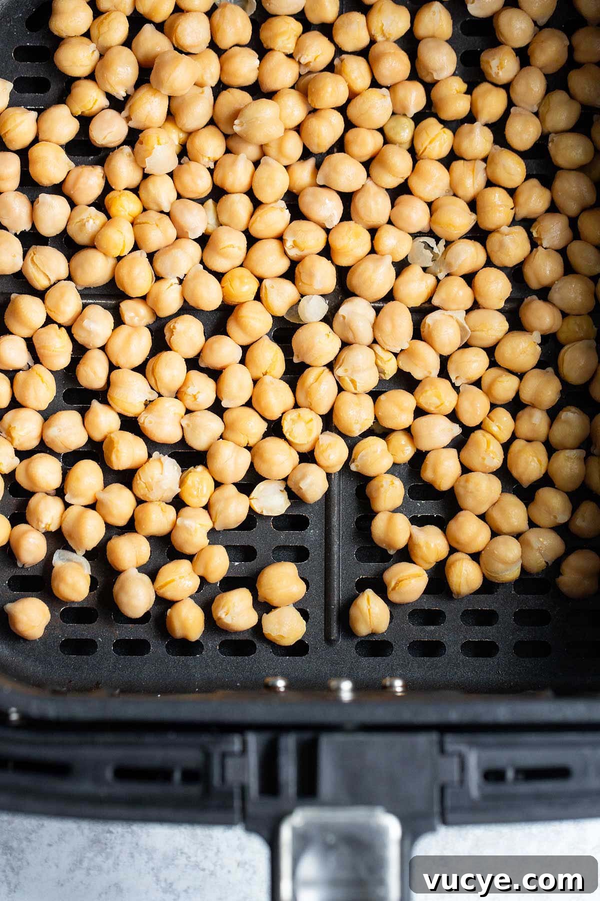 Crispy Oil-Free Air Fryer Chickpeas for Snacking 4 Uncooked chickpeas in air fryer basket