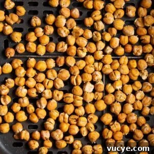 Crispy Oil-Free Air Fryer Chickpeas for Snacking 8 Crispy air fryer chickpeas with no oil in air fryer basket