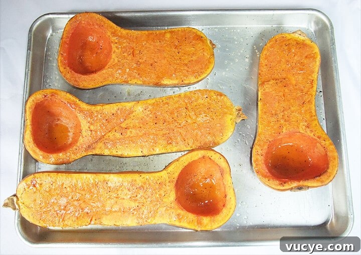 A pan of halved butternut squash for soup.