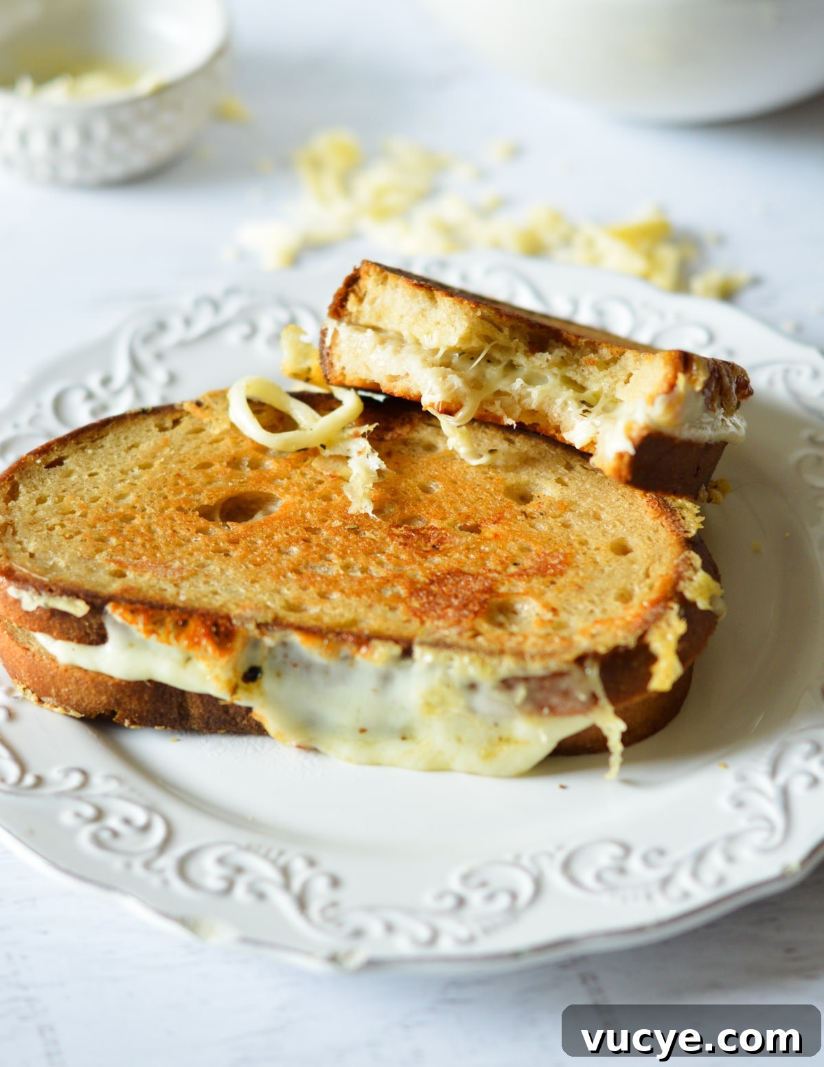 half a grilled cheese on top of a grilled cheese sandwich. 