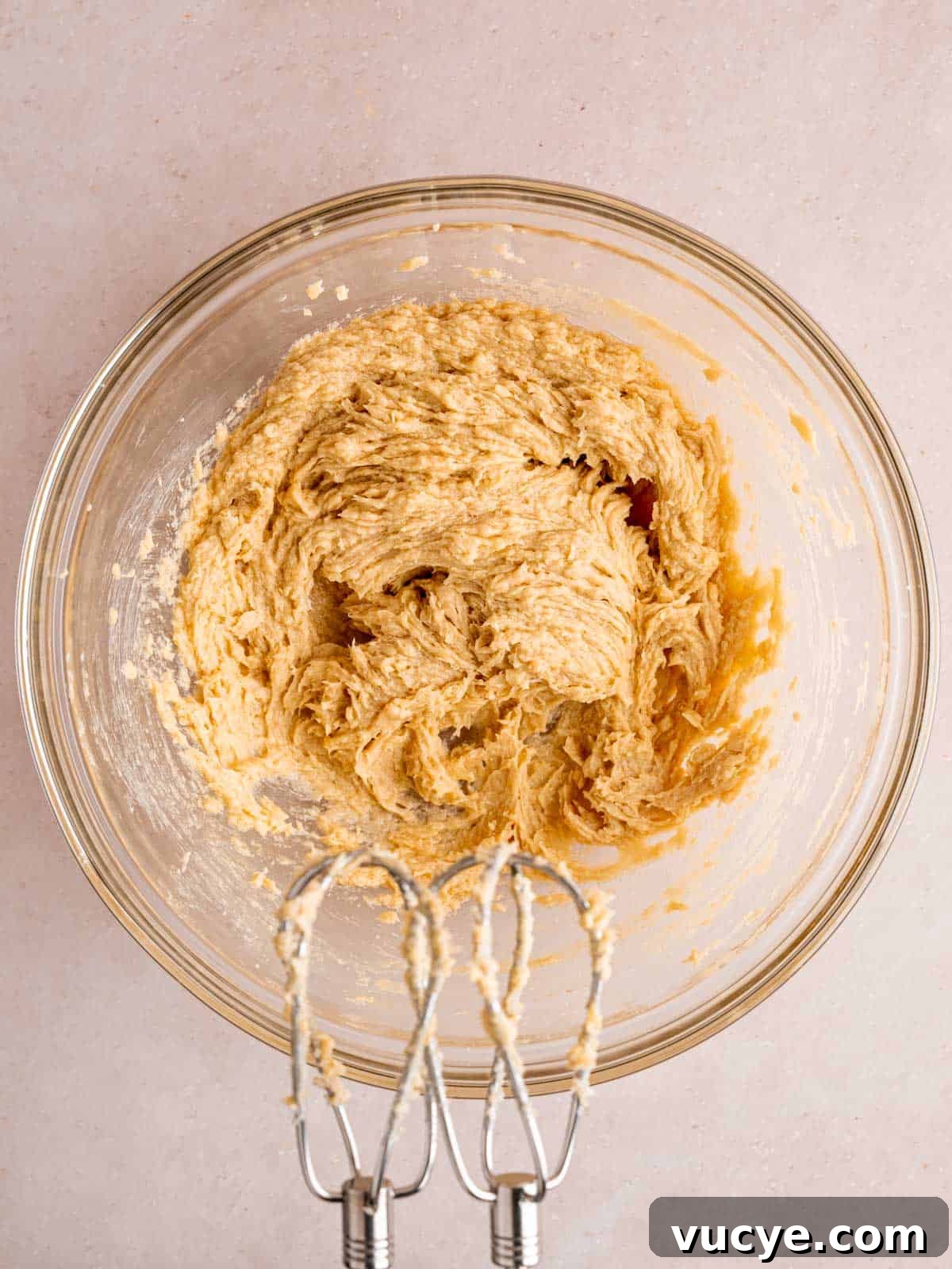 White Chocolate Macadamia Nut Cookies Recipe You’ll Love 4 Butter, sugars, egg, and vanilla extract mixed together in a bowl.