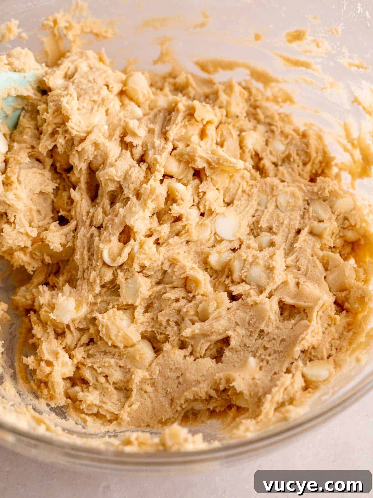 White Chocolate Macadamia Nut Cookies Recipe You’ll Love 6 White chocolate chip macadamia nut cookie dough in a bowl.