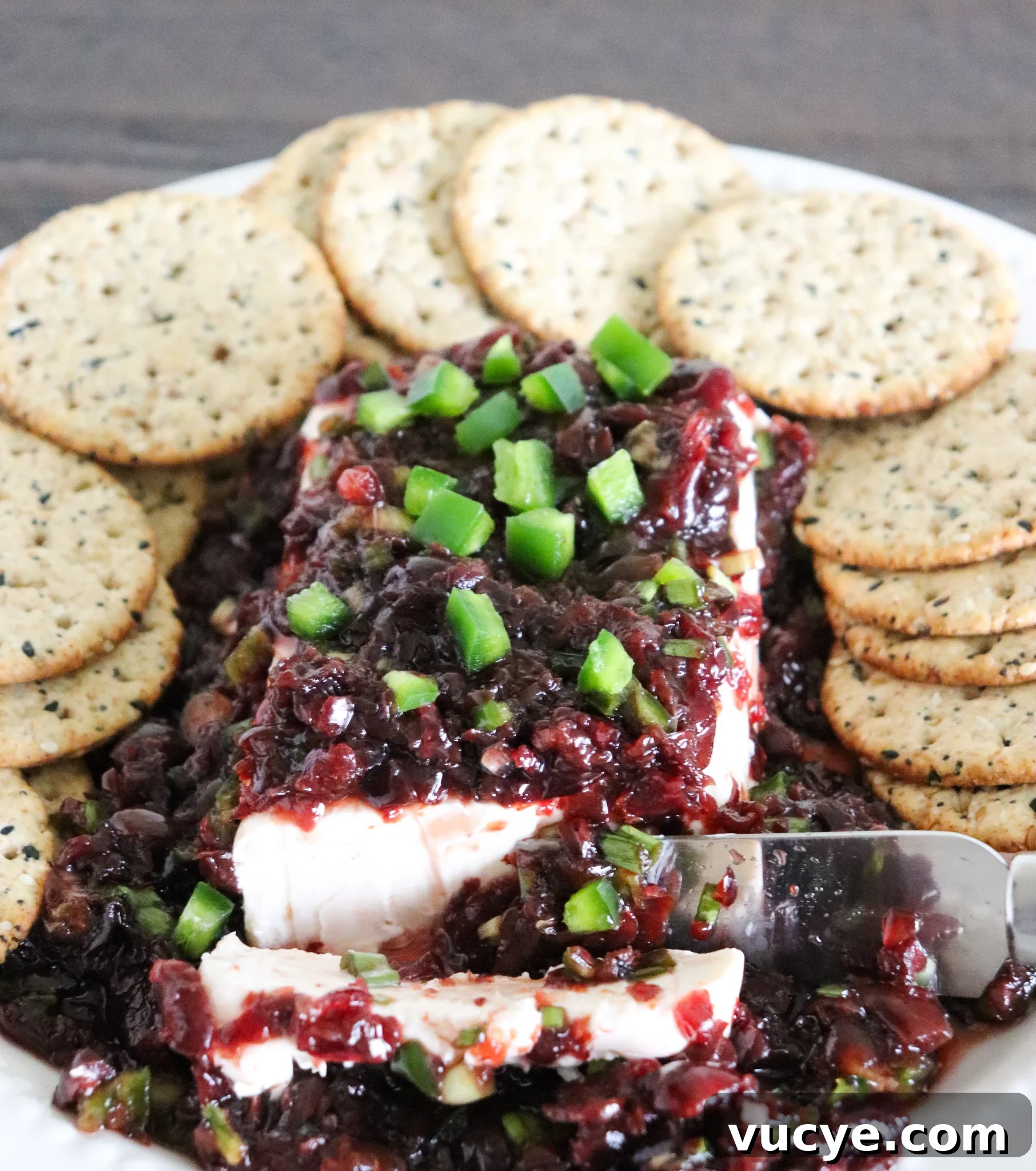 Cherry Jalapeño Cream Cheese Dip Recipe for Parties 2 cherry jalapeno relish over cream cheese with crackers