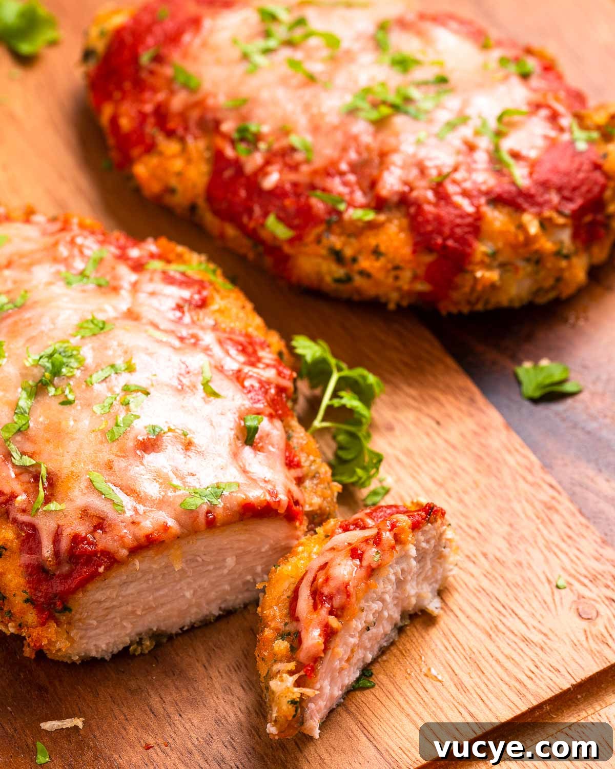 Slicing into a keto chicken parmesan cutlet.