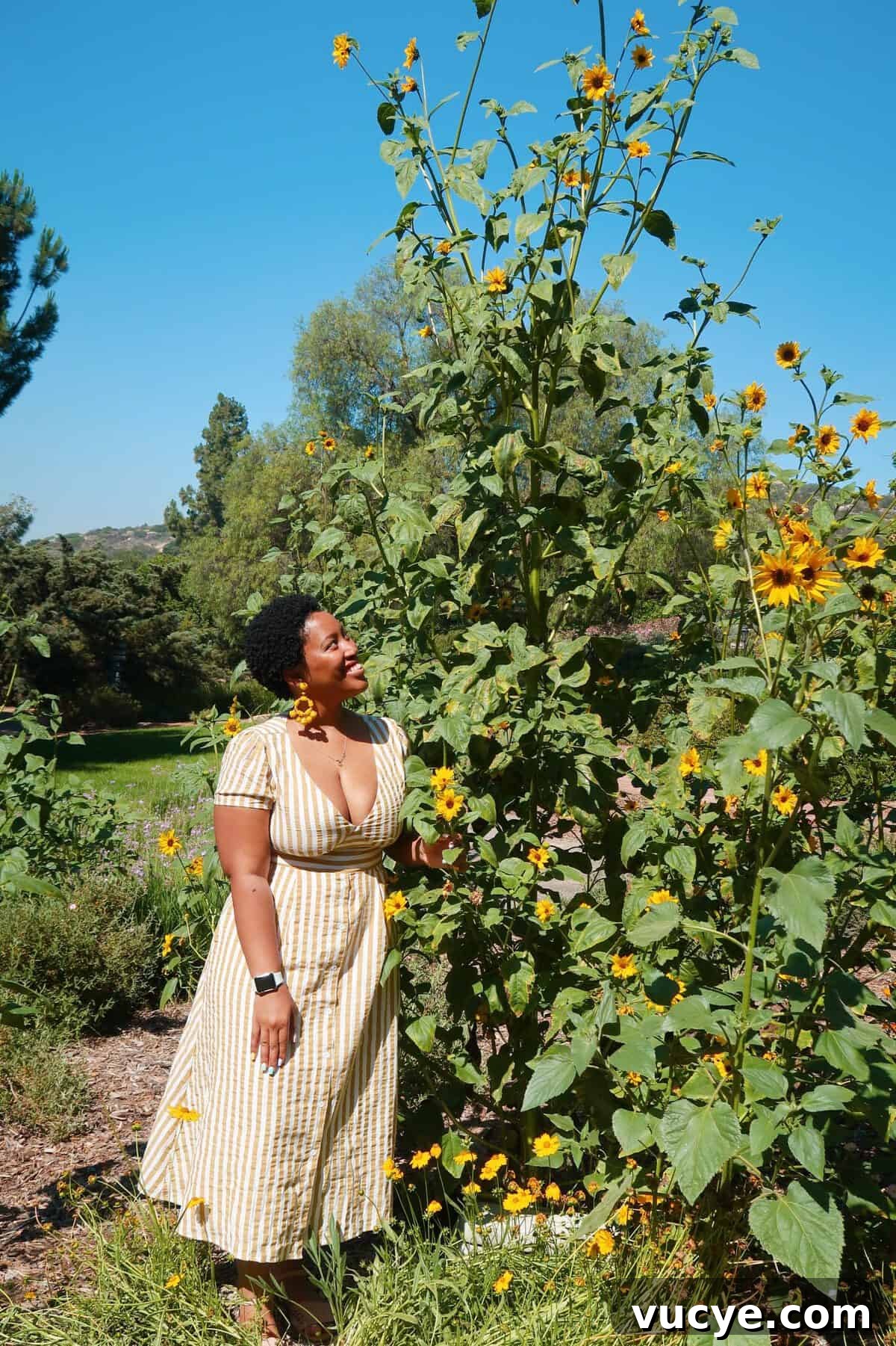 Week at Rancho La Puerta: Your Ultimate Wellness Retreat Guide 2 Jessica smiling at a bush.