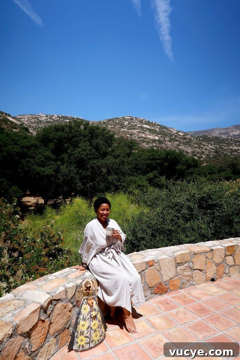 Week at Rancho La Puerta: Your Ultimate Wellness Retreat Guide 6 Jessica sitting outside, holding a mug.