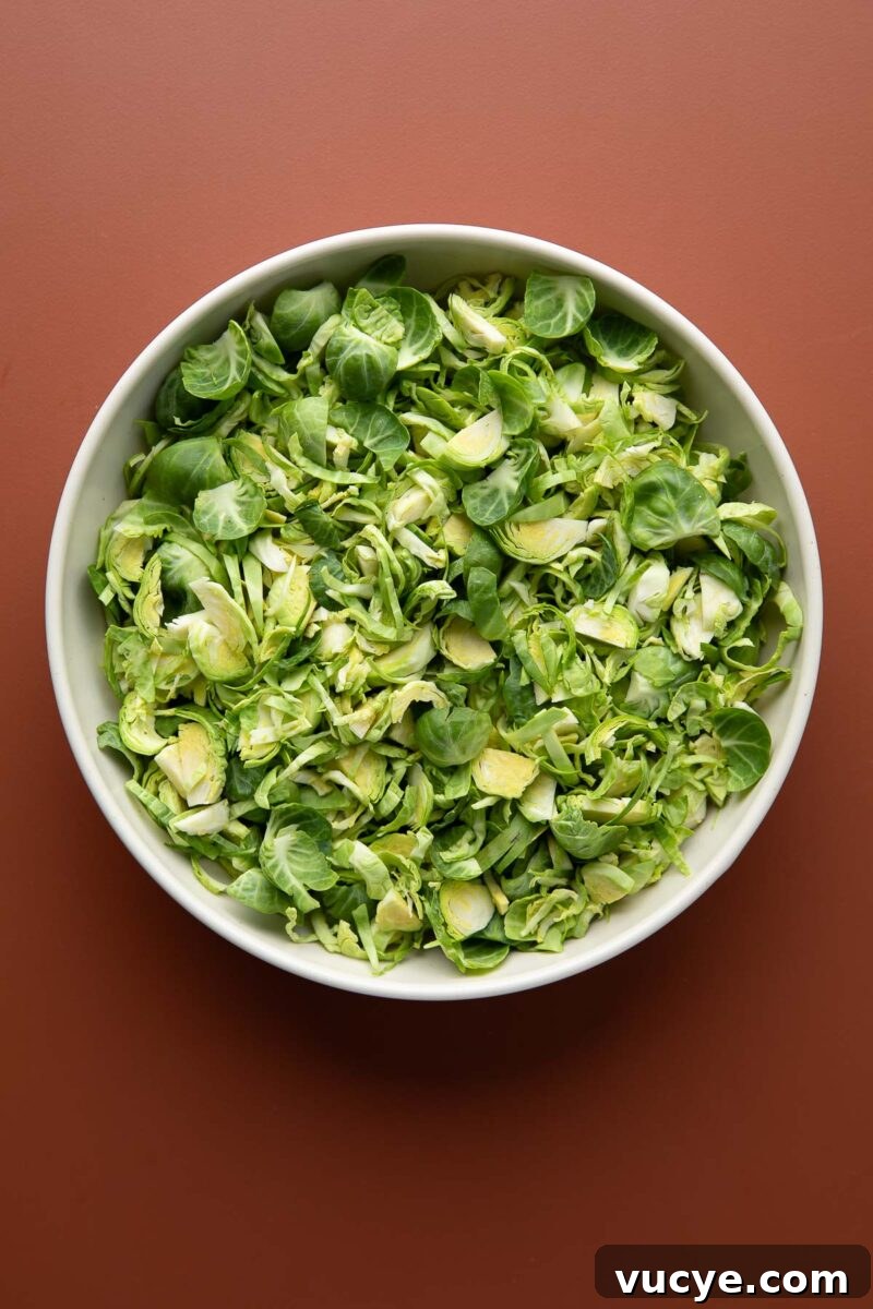 Apple Cranberry Brussels Sprout Salad with Maple Citrus Vinaigrette 3 shredded chopped brussels sprouts