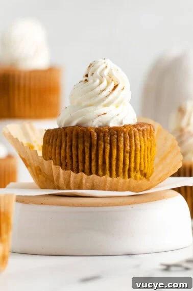 Classic Gluten-Free Apple Pie Recipe for Perfect Autumn Baking 11 pumpkin pie cupcake with wrapper off topped with whipped cream