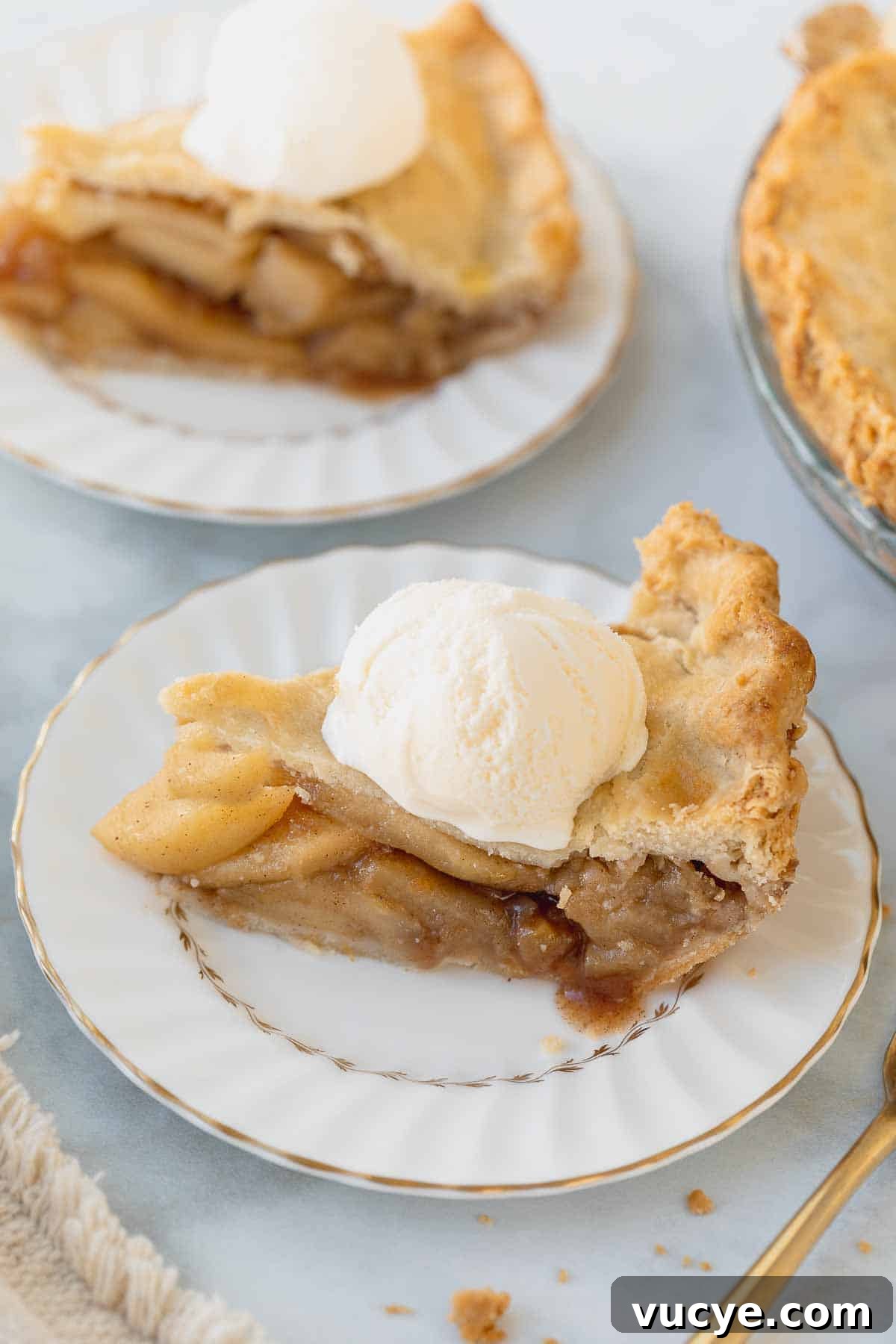 Classic Gluten-Free Apple Pie Recipe for Perfect Autumn Baking 8 gluten-free apple pie slice on white plate topped with ice cream