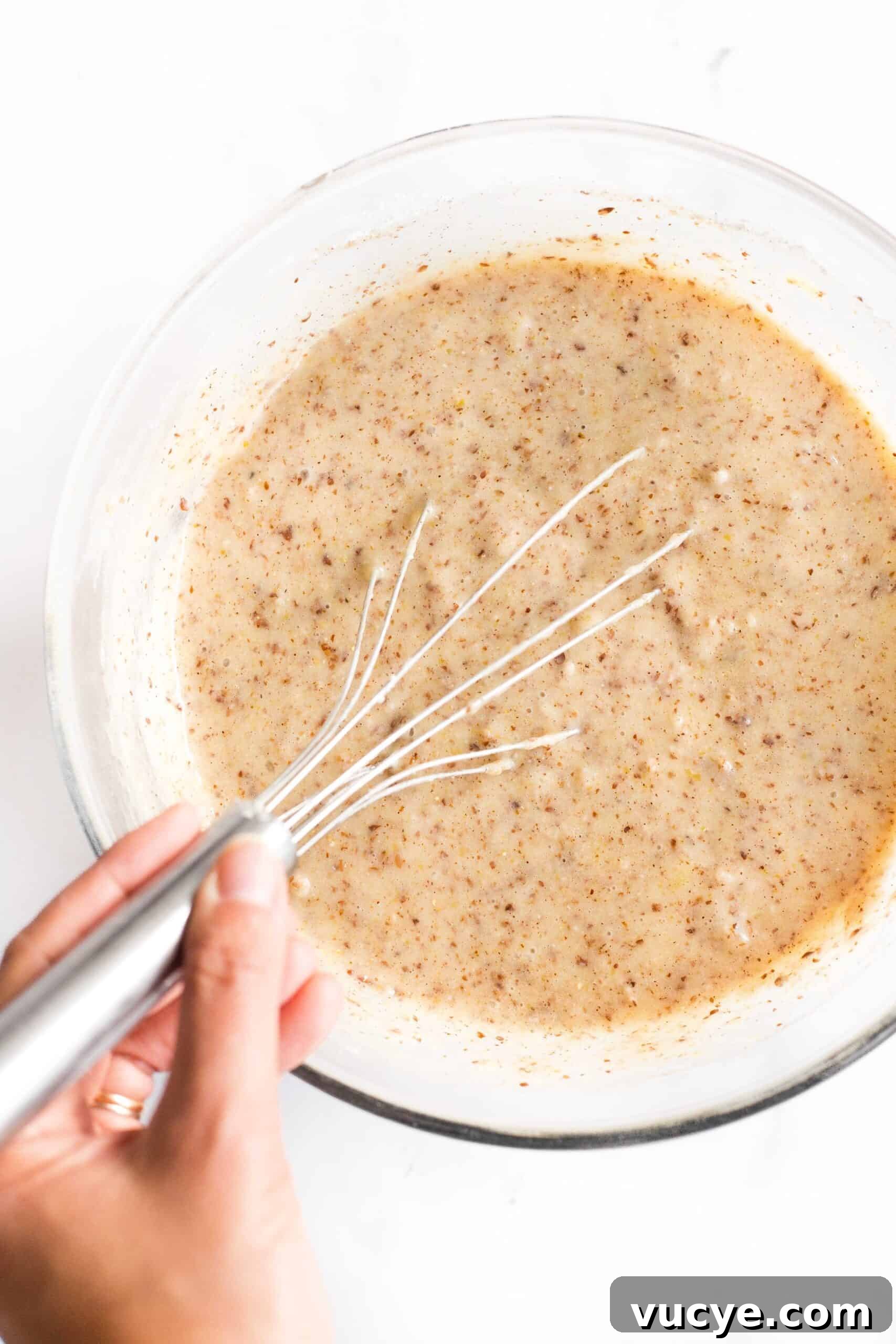 Easy Flax Bread (Gluten-Free, Dairy-Free) Mixing flaxseed bread batter in a bowl.