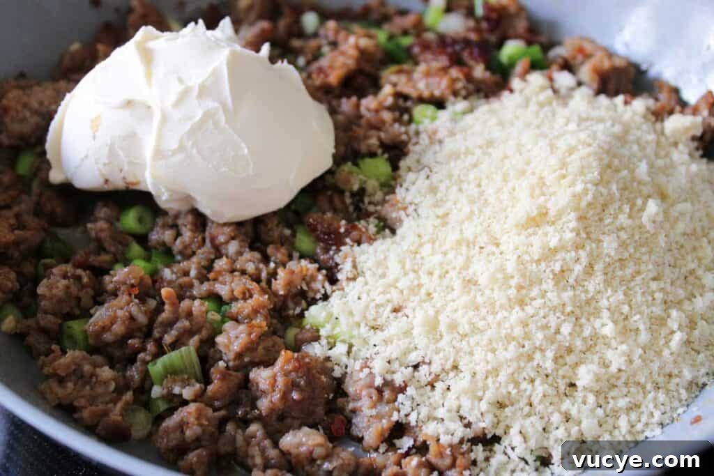 Italian-Style Stuffed Mushrooms with Garlic & Parmesan 7 adding breadcrumbs and mascarpone to ground sausage