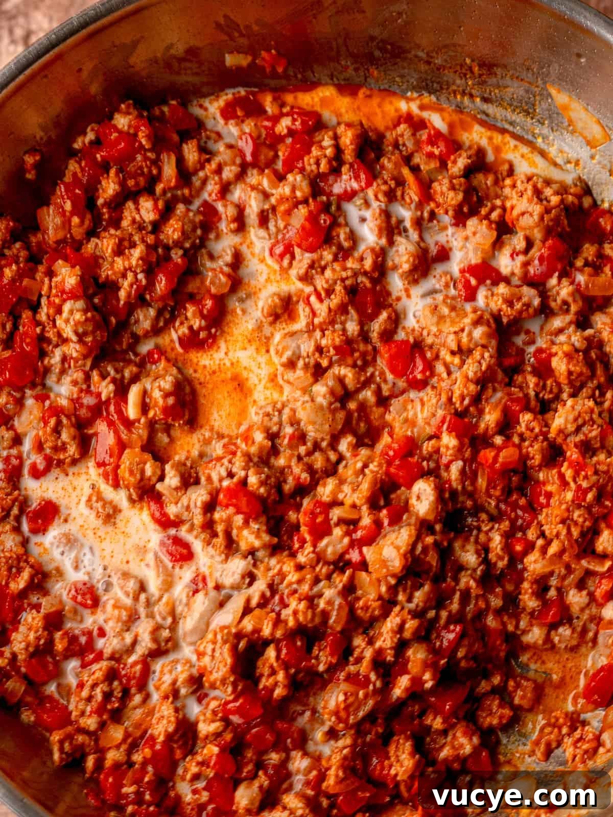 Italian sausage sauce in a skillet.