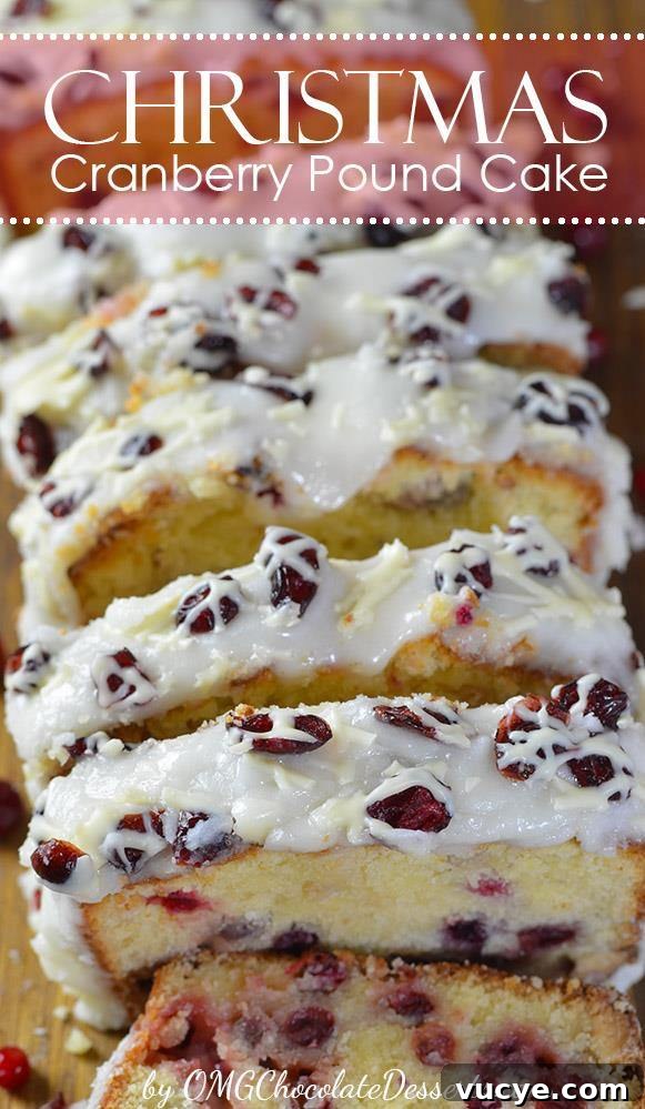 Cranberry Pound Cake sliced and arranged, showing the soft, moist texture and cranberries embedded throughout, topped with white glaze and sprinkled with cranberries.