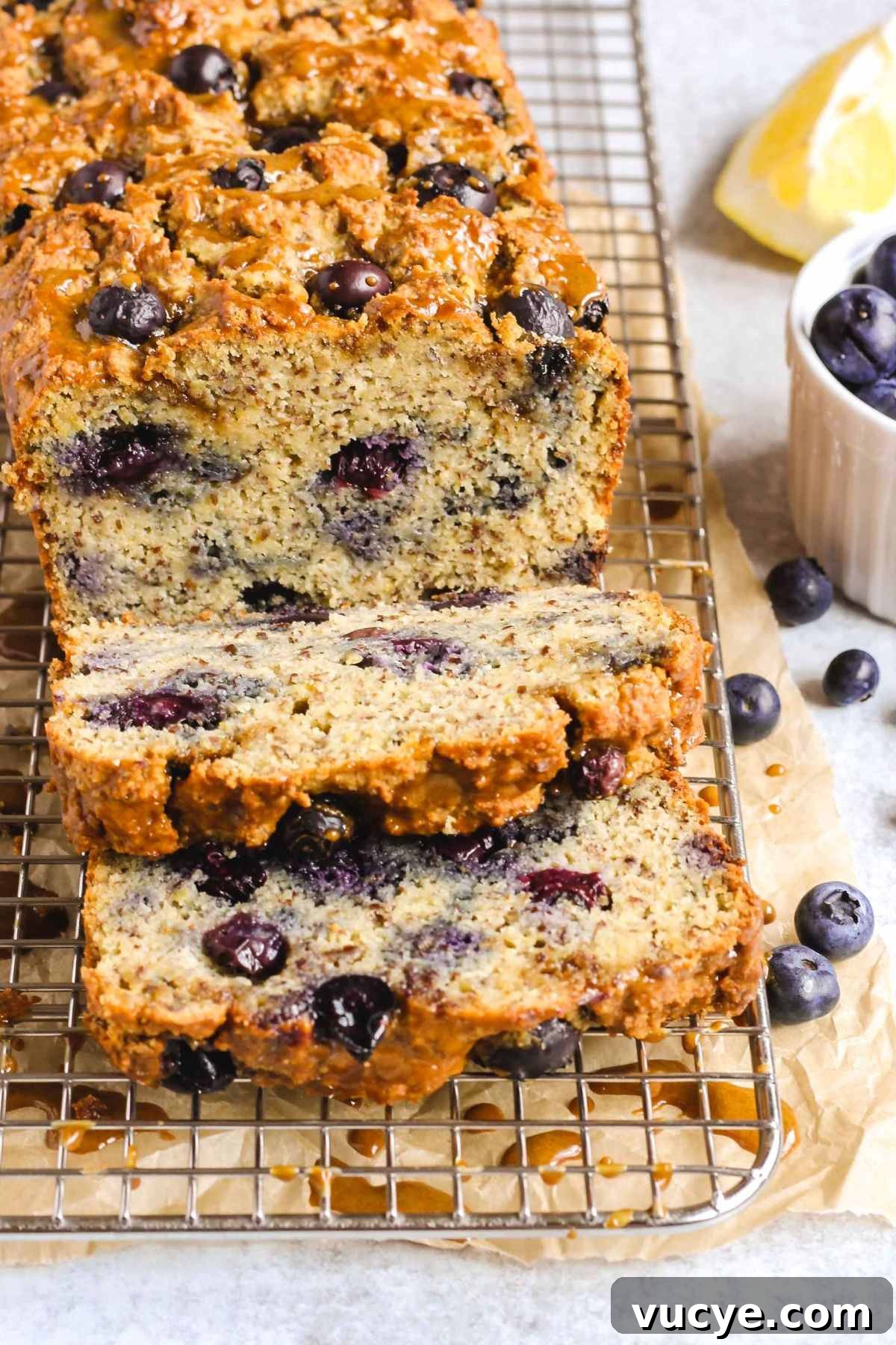 Sliced loaf of almond flour blueberry lemon bread.