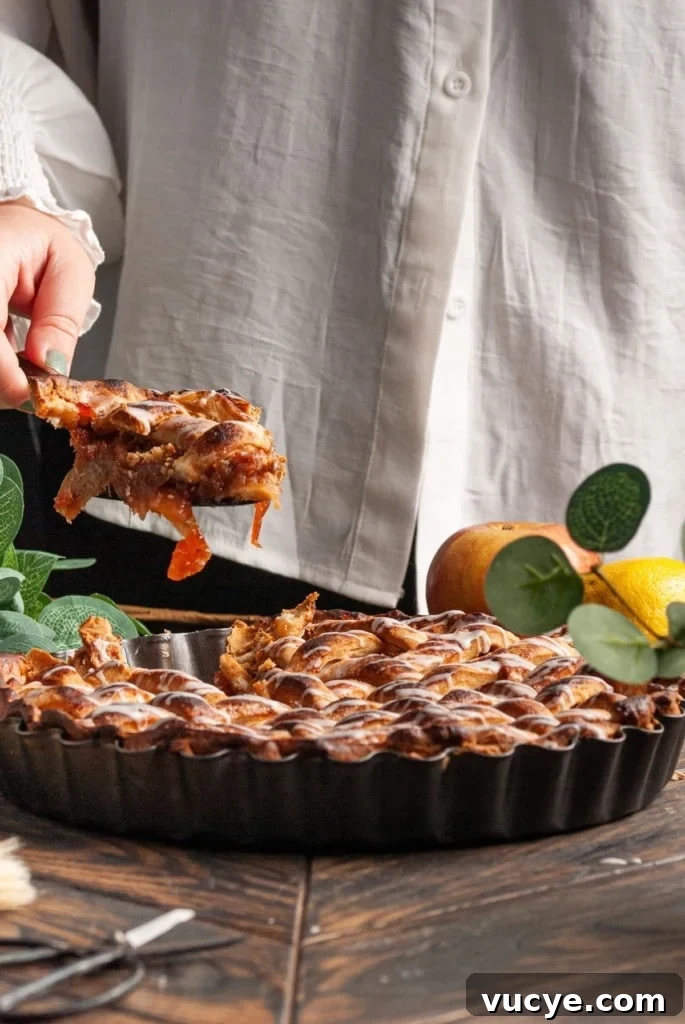 Bourbon-Drizzled Drunken Apple Pie Recipe 14 Serving a slice of apple pie