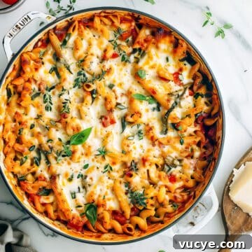 7-Day Budget Meal Plan for April 13–19: Affordable Weekly Menu 7 Vegetable pasta bake with penne in a casserole dish with baked cheese.