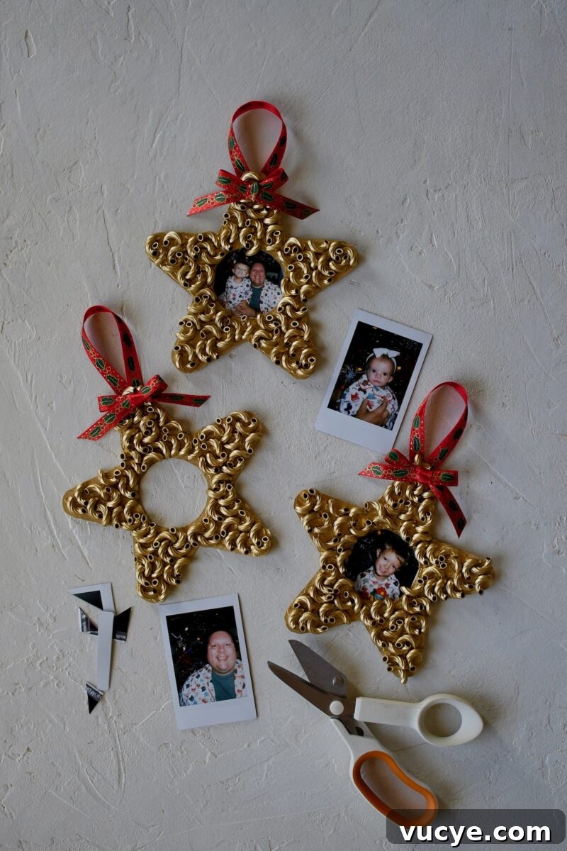 Handmade Pasta Christmas Ornaments: DIY Holiday Decorating Ideas 9 Dry Macaroni star ornaments after spray painting gold, with polaroid pictures around them, ready to be cut to size.