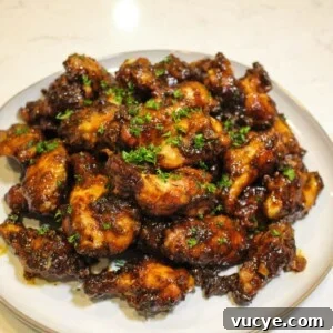 overhead of a plate of honey chipotle garlic chicken wings