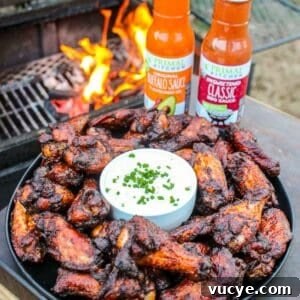 Smoked and twice fried chicken wings seasoned with Primal Kitchen BBQ Sauce and Buffalo Sauce is foodie heaven.