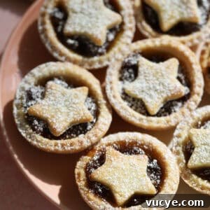 Panettone Bread and Butter Pudding Recipe — Festive Dessert Guide 11 A plate of gluten free mince pies with star tops.