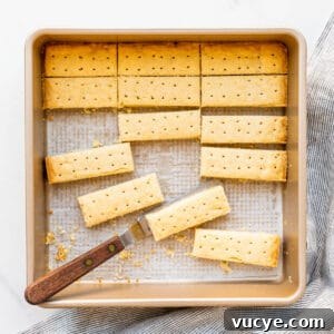 Shortbread cookies cut into sticks in a square pan.