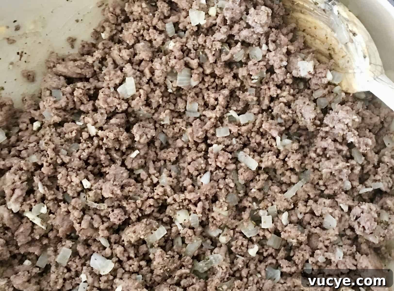 ground beef cooking on stove