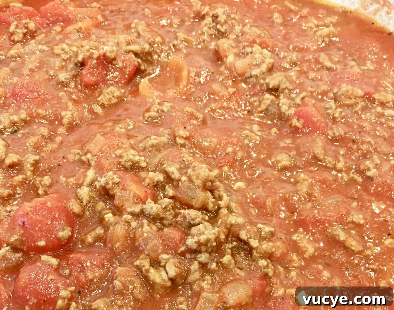 close up of sauce cooking on stovetop.