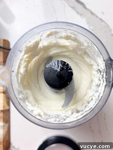 Whipped Goat Cheese and Blackberry Crostini Recipe 13 Goat cheese and cream in a food processor.