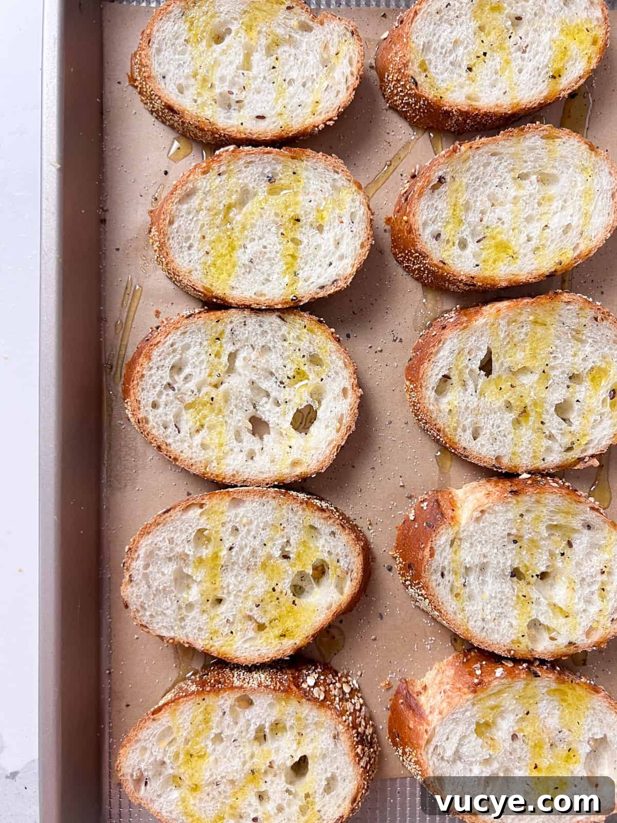 Whipped Goat Cheese and Blackberry Crostini Recipe 4 Crostini in a baking pan with olive oil.