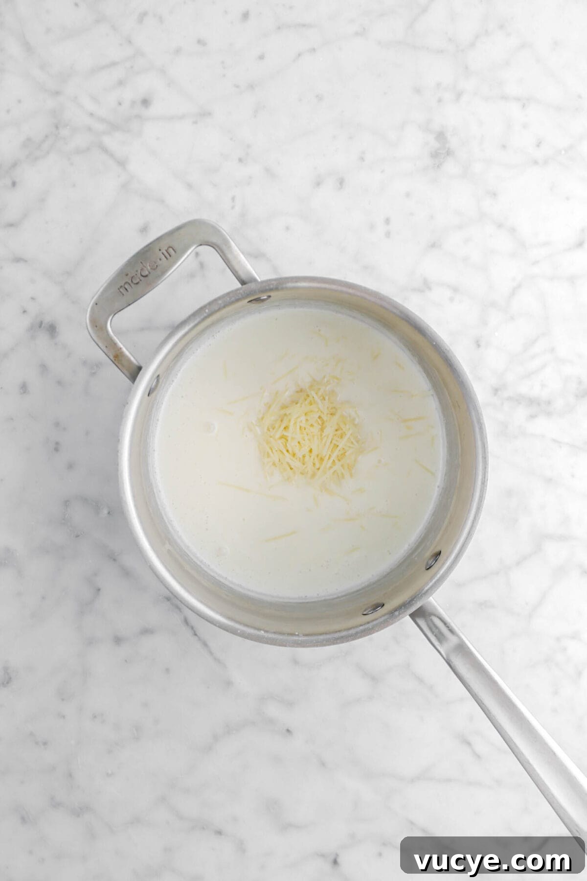 Creamy Four-Cheese Macaroni and Cheese Recipe 13 parmesan added to cream mixture