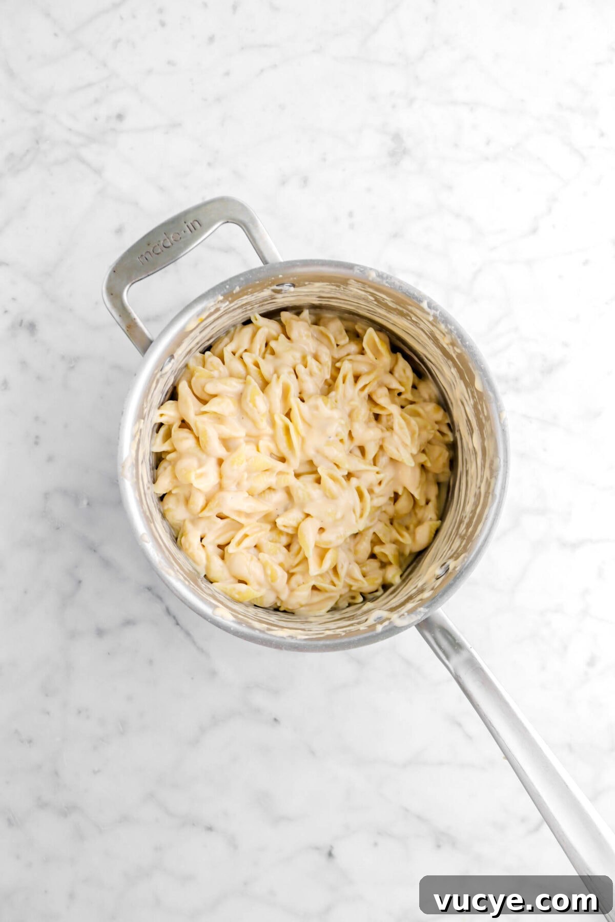 Creamy Four-Cheese Macaroni and Cheese Recipe 16 macaroni and cheese in small pot