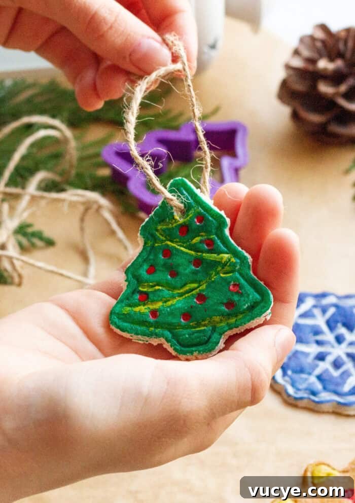 baked and painted salt dough ornament in the shape of a Christmas tree