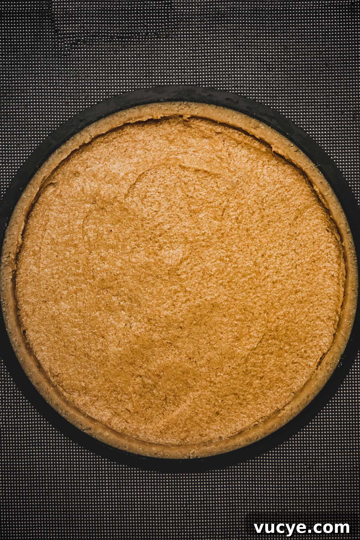 tart pan filled with a tart dough and almond cream