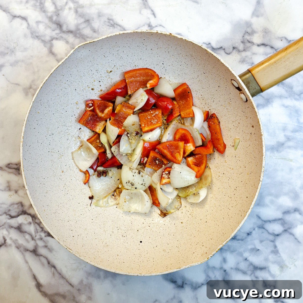 Crispy Salt and Pepper Chicken Recipe for Dinner 11 Chopped onions and red peppers softening in a wok.