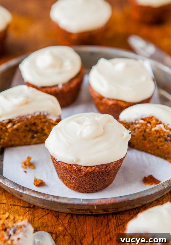 Carrot Cake Cupcakes with Vanilla Cream Cheese Frosting Carrot Cake Cupcakes topped with cream cheese frosting.