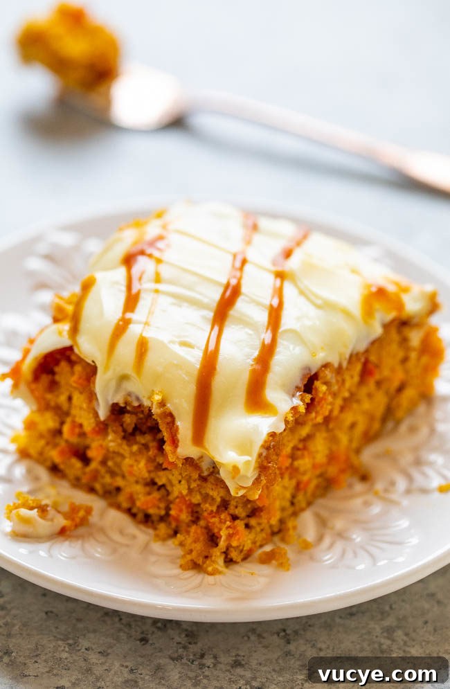 Carrot Cake Cupcakes with Vanilla Cream Cheese Frosting Recipe 10 A slice of Salted Caramel Carrot Cake with Cream Cheese Frosting on a plate.