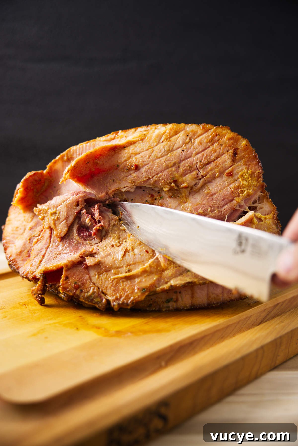 Double-Smoked Ham Techniques for Rich, Smoky Flavor 11 Cutting bone out of spiral sliced ham.
