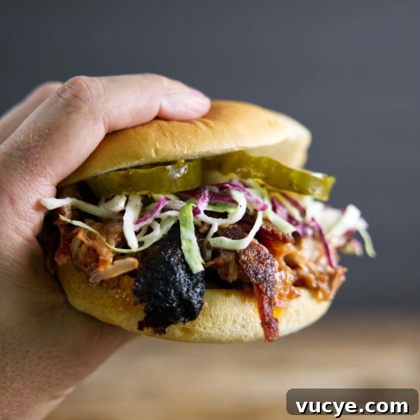 Double-Smoked Ham Techniques for Rich, Smoky Flavor 13 Pulled pork sandwich made from smoked pork butt (smoked pork shoulder). With pickles, slaw, and BBQ sauce.